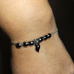 Bracelet with bead slides and seashell charm